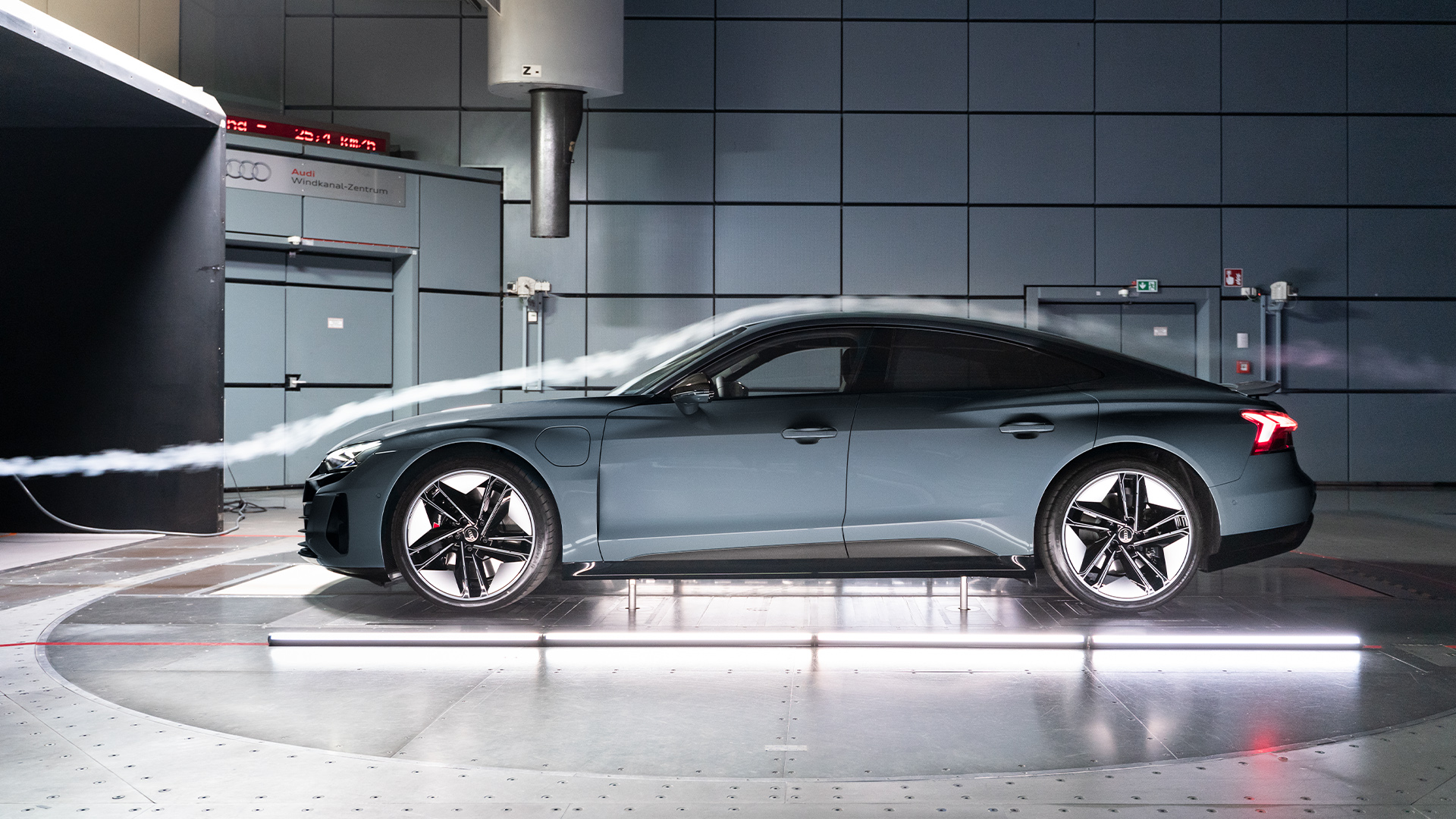 Side profile of a column of air flowing over an RS Audi e-tron GT in the wind tunnel.   