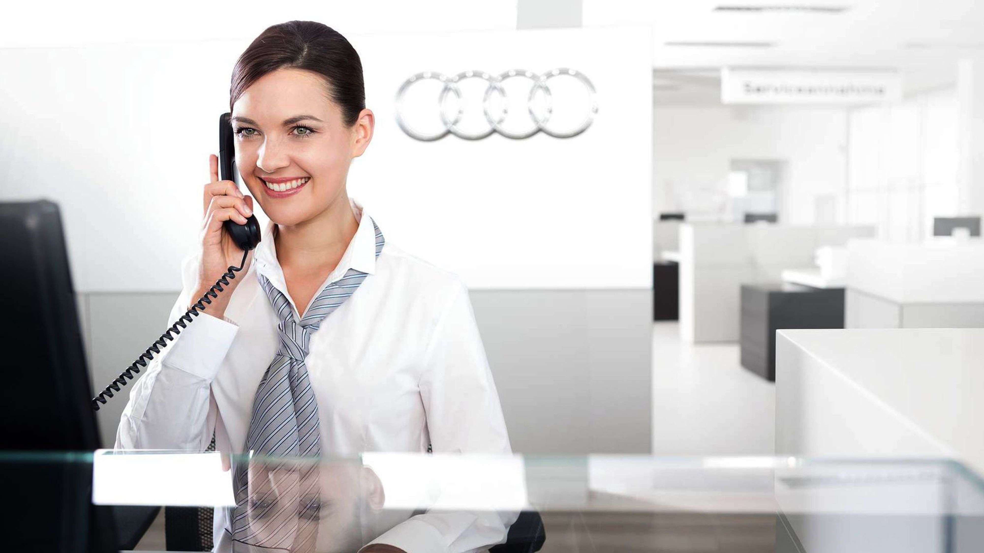 View of Audi Dealer employee on the phone.