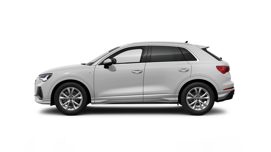 Side profile of a grey Audi Q3 parked.