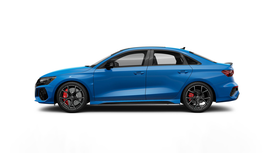 Side profile of a blue Audi RS 3 parked.