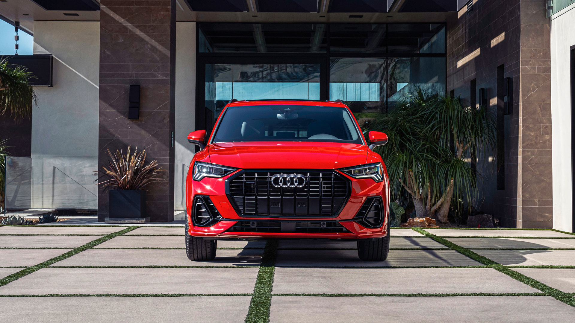 Front view of a red Audi Q3. 